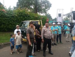 Bhabinkamtibmas Amankan Karnaval HUT ke-40 Kelurahan Benda Baru